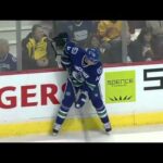Cal Clutterbuck flies into Canucks bench after missing hit 3/14/11