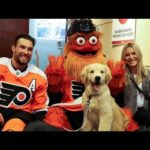 Flyers mascot Gritty meets Ivan Provorov with his dog