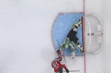 Anton Khudobin flashes the leather to rob Jonathan Toews