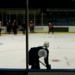 Travis Hamonic runs drills