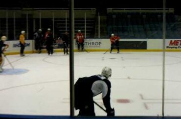 Travis Hamonic runs drills