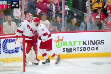 #74 Jaccob Slavin getting hit behind the net by  Panthers #9 Sam Bennett