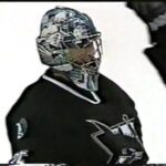 Goalie Evgeni Nabokov ( San Jose Sharks ) scores a goal against Canucks 2002
