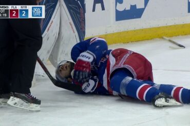 Zibanejad injured sliding hard into end boards feet first