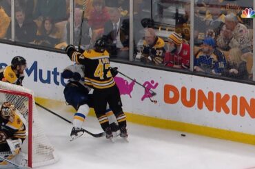 Torey Krug lays out Alexander Steen behind the net