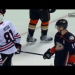 Perry tries to steal Hossa’s stick