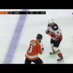 Kevin Bieksa knocks down Radko Gudas with a Superman punch