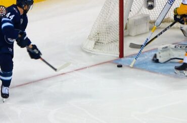 Josh Morrissey looks to sky after Pekka Rinne stick save