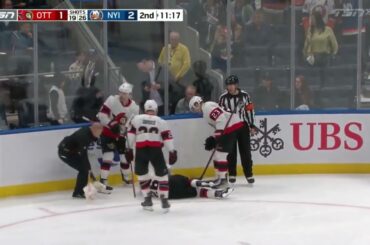 Erik Brannstrom Is Down On The Ice After Taking A Hit From Cal Clutterbuck