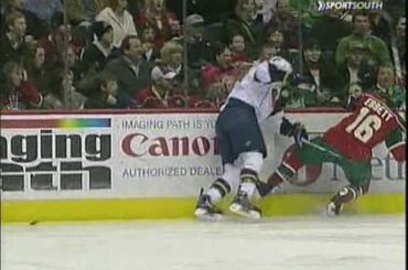 Zach Bogosian checks Andrew Ebbett