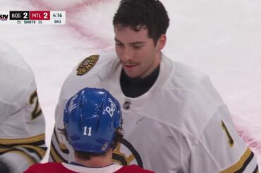 Brendan Gallagher pulls off Jeremy Swayman's mask and smiles in scrum