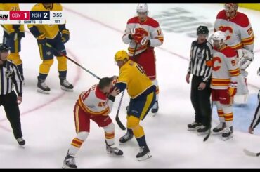 Dennis Gilbert drops the gloves with Michael McCarron