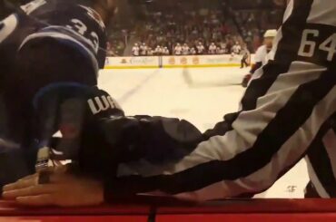 Dustin Byfuglien front row view hit on mark stone