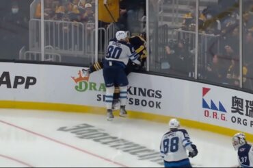 Pierre-Luc Dubois checks Charlie Coyle through the glass 1/22/22