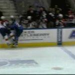 Jim Slater hits Dmitry Kulikov