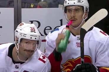 Flames' Brouwer photobombs Backlund after goal to show off fine moustache