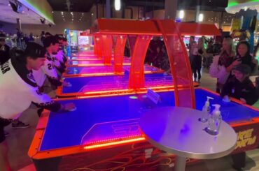 Clayton Keller, Barrett Hayton, Matt Dumba and JJ Moser playing air hockey vs fans