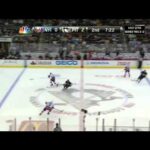 John Tavares stickhandles past Paul Martin 5/8/13