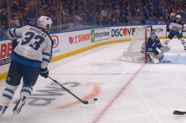 Dustin Byfuglien banks the puck in off Jordan Binnington