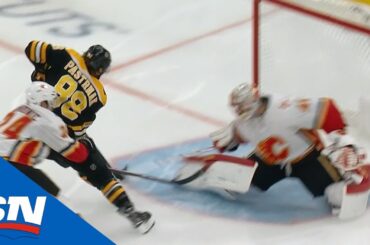 Torey Krug banks pass off end boards to David Pastrnak for sweet goal