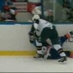 Dustin Byuglien drops Travis Hamonic