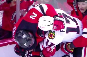 Devils' Smith big hit on Black Hawks' Bedard; Smith, Black Hawks' Foligno receive roughing penalties