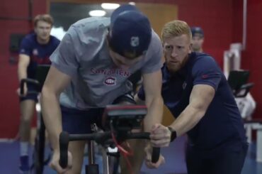 Juraj Slafkovsky riding a stationary bike - Monteral testing players