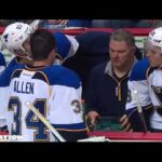 Jake Allen watches shootout video on the bench