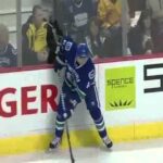 Cal Clutterbuck misses a hit and ends up in Canucks bench