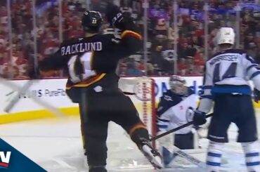 Flames Keep Puck Alive Before Mikael Backlund Sneaks One Past Eric Comrie